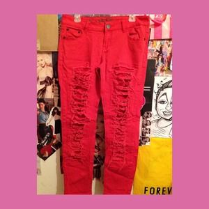 Bright red/orange shredded distressed skinny jeans