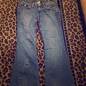Light tarnished true religion flare jeans