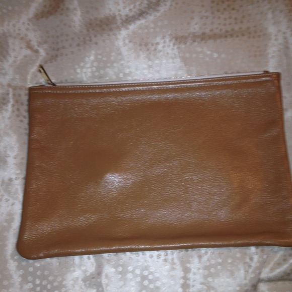 Oversized tan clutch