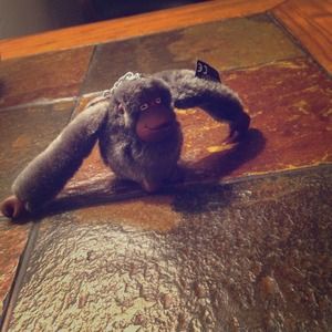 Gray kipling monkey accessory