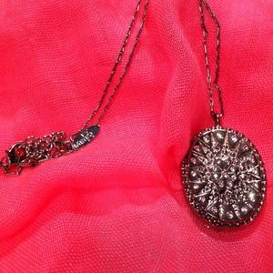 Oval medallion necklace.