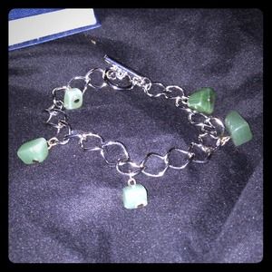 Silver bracelet with green stones