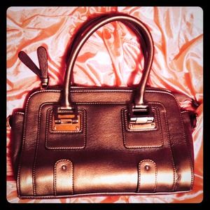 Cute, medium sized purse. Gold/silver color.