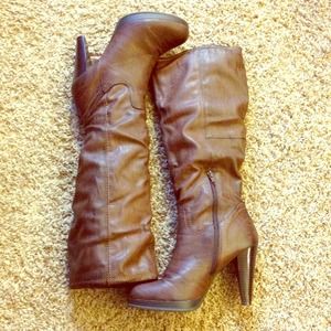 Brown distressed faux leather boots.