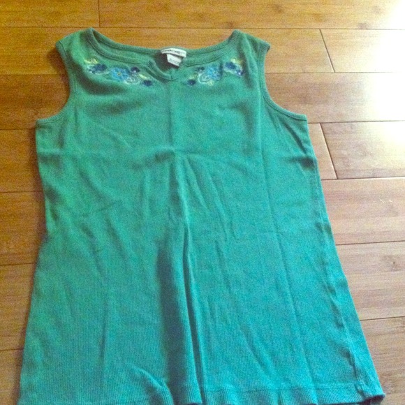A green shirt that and it is a tank top