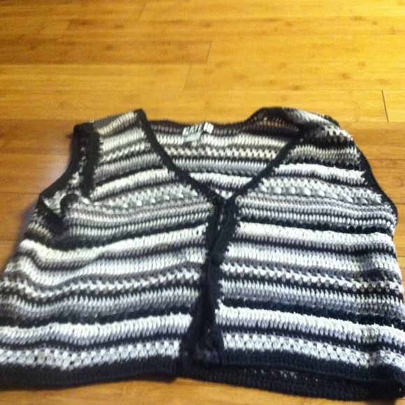 A black grey and white vest