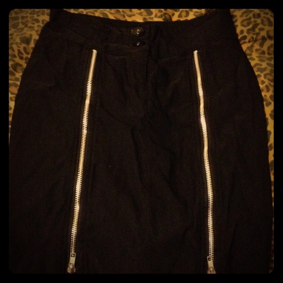 Black form fitting zipper pencil skirt.
