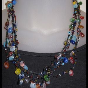 5strands of multi colored glass beads from Turkey.
