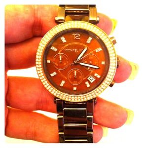 Watch with gold diamonds around the face