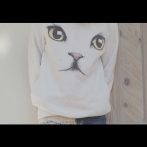White cat sweater.