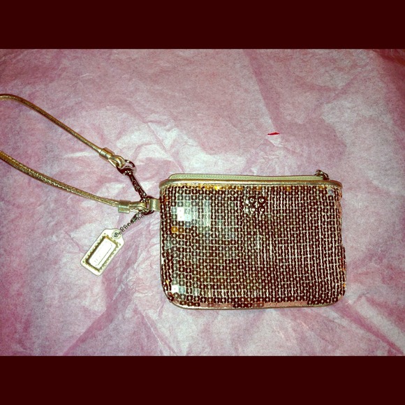 Rose gold Coach wristlet