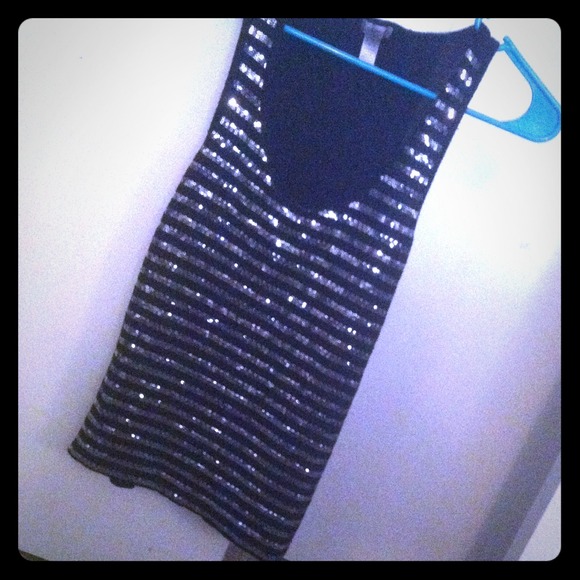 Black and silver sequined top .