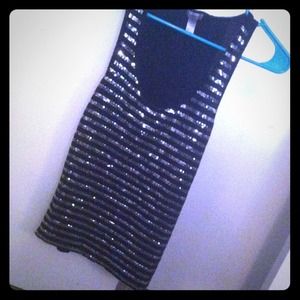 Black and silver sequined top .