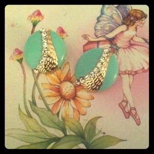 Mint green and gold earrings .