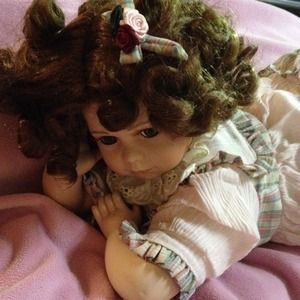 Laying down porcelain doll