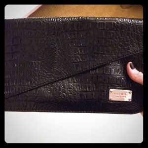 Black snake skin clutch Nine west