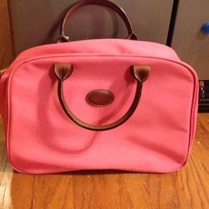 Hot pink Longchamp carry on + black Longchamp