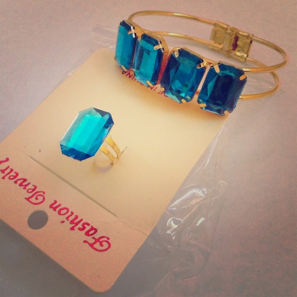 Gold bracelet with matching blue diamond ring
