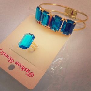 Gold bracelet with matching blue diamond ring