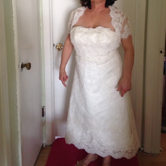 Beautiful beaded lace tea length wedding gown