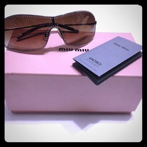Authentic Miu Miu sunglasses with crystal inlay.
