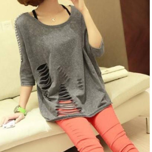 Distressed spike shoulder sweater