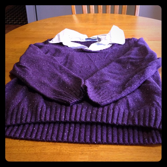 Purple sweater with white specks of thread. Collar
