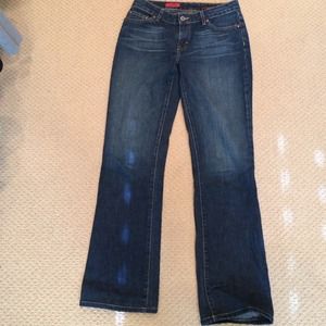 AG dark wash denim jeans style is "the Gemini".