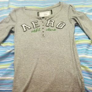 A 3 quarter grey shirt with "AERO" "athletics