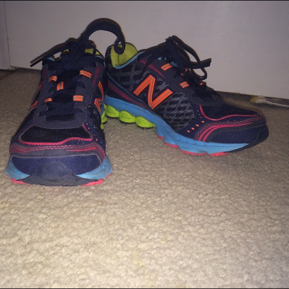 New Balance multi-colored tennis shoes.