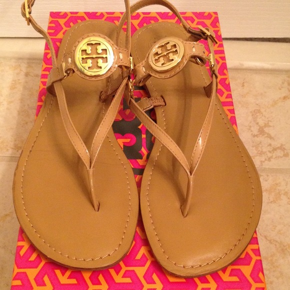 Tory Burch sandals with gold hardware.