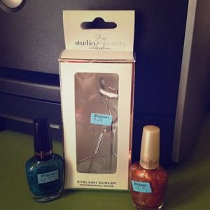 Eyelash curler and 2 nail colors...