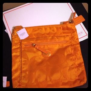 coach wallets orange