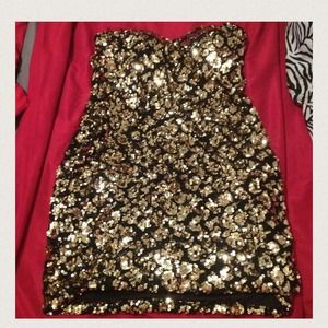 Gold sequin dress.