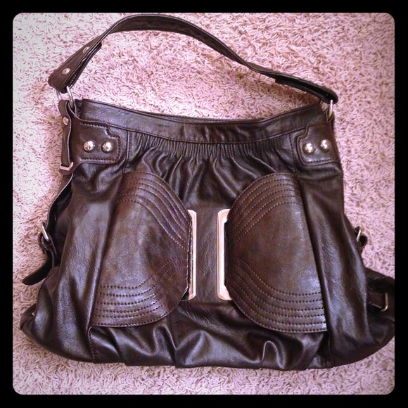 Brown purse with strap, zip closure, & inside zips