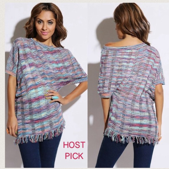 Multi colored asymmetrical sweater with fringe.