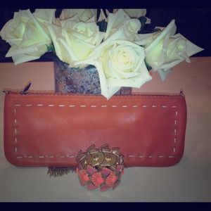 BCBG orange leather clutch