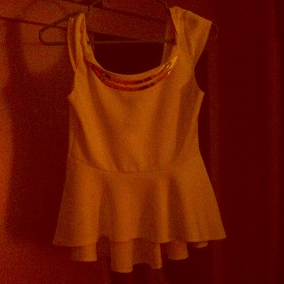 I'm selling a white and gold going out shirt.