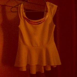 I'm selling a white and gold going out shirt.