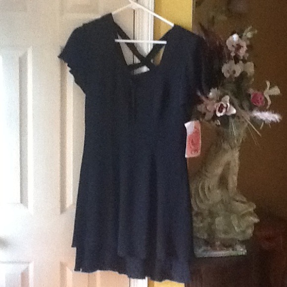 Caren Desiree company black dress