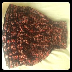 Maroon, cream beige, and black spotted dress.