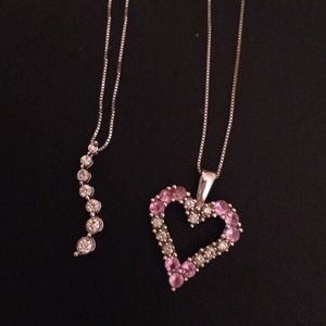 2 white gold necklaces with diamonds.