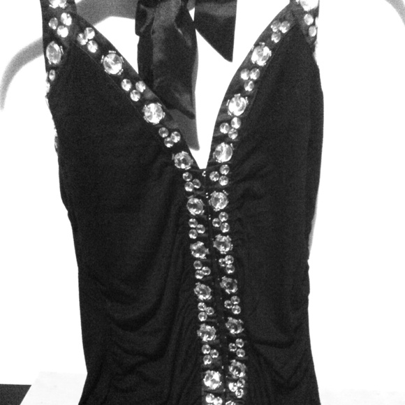 Gem top. Satin trim, material is cotton spandex.