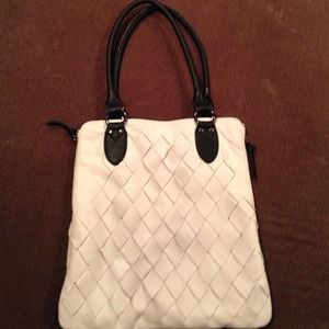 White woven handbag with black trim
