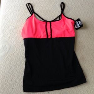 Workout top. Never worn. $15 a piece.