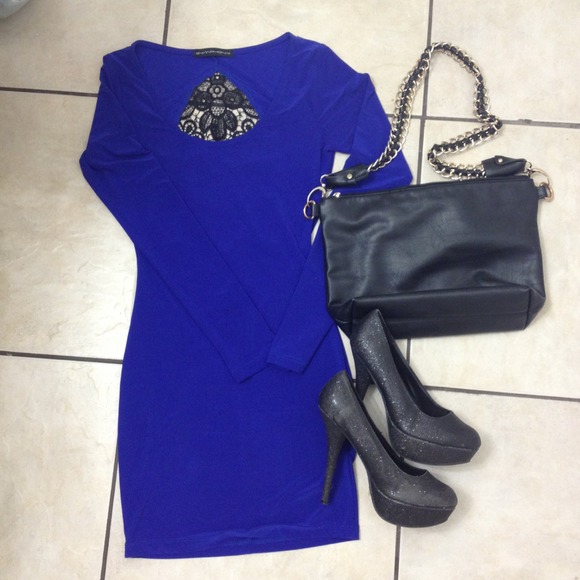 Dark blue tight long sleeve dress .
