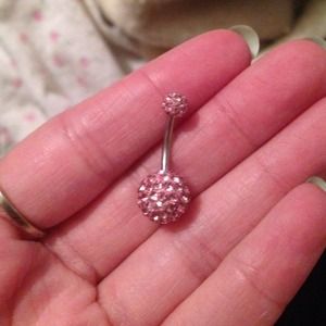 Pink jeweled belly button ring