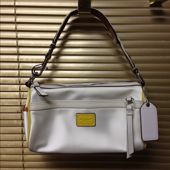 White coach purse with yellow trim