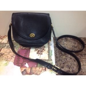 Leather cross body coach purse.