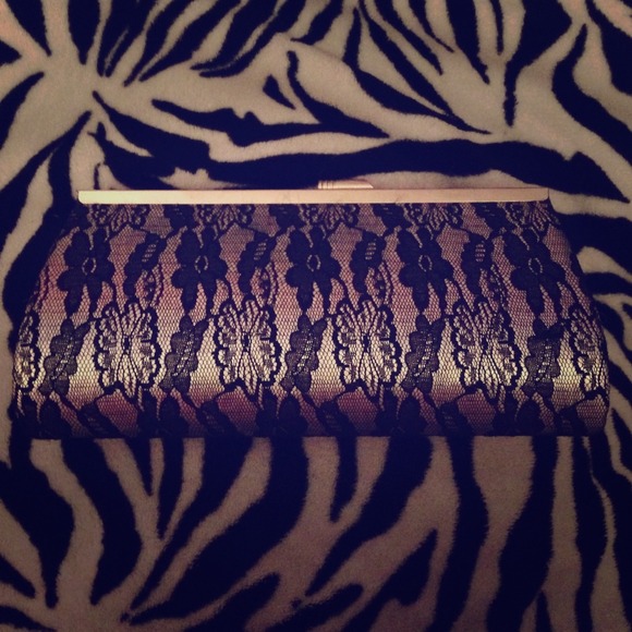 Small hand clutch; sliver and black